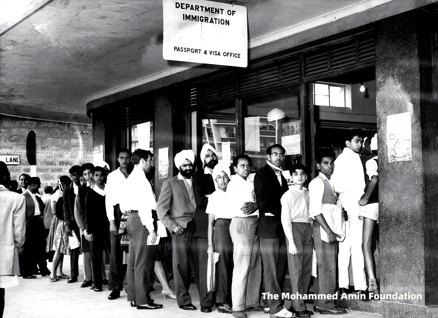 Asians queue up at the Immigration office
